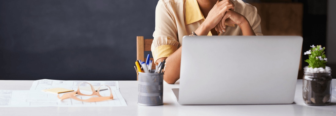 Cropped view of a business woman working on a laptop